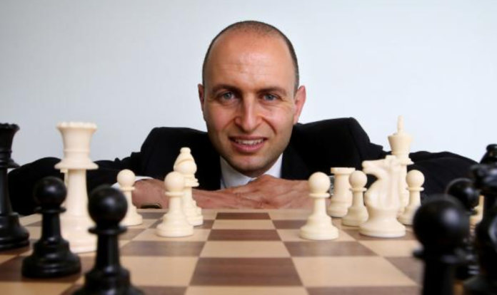 john adams chess economist